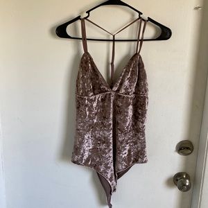 Sexy criss crossed halter top bodysuit